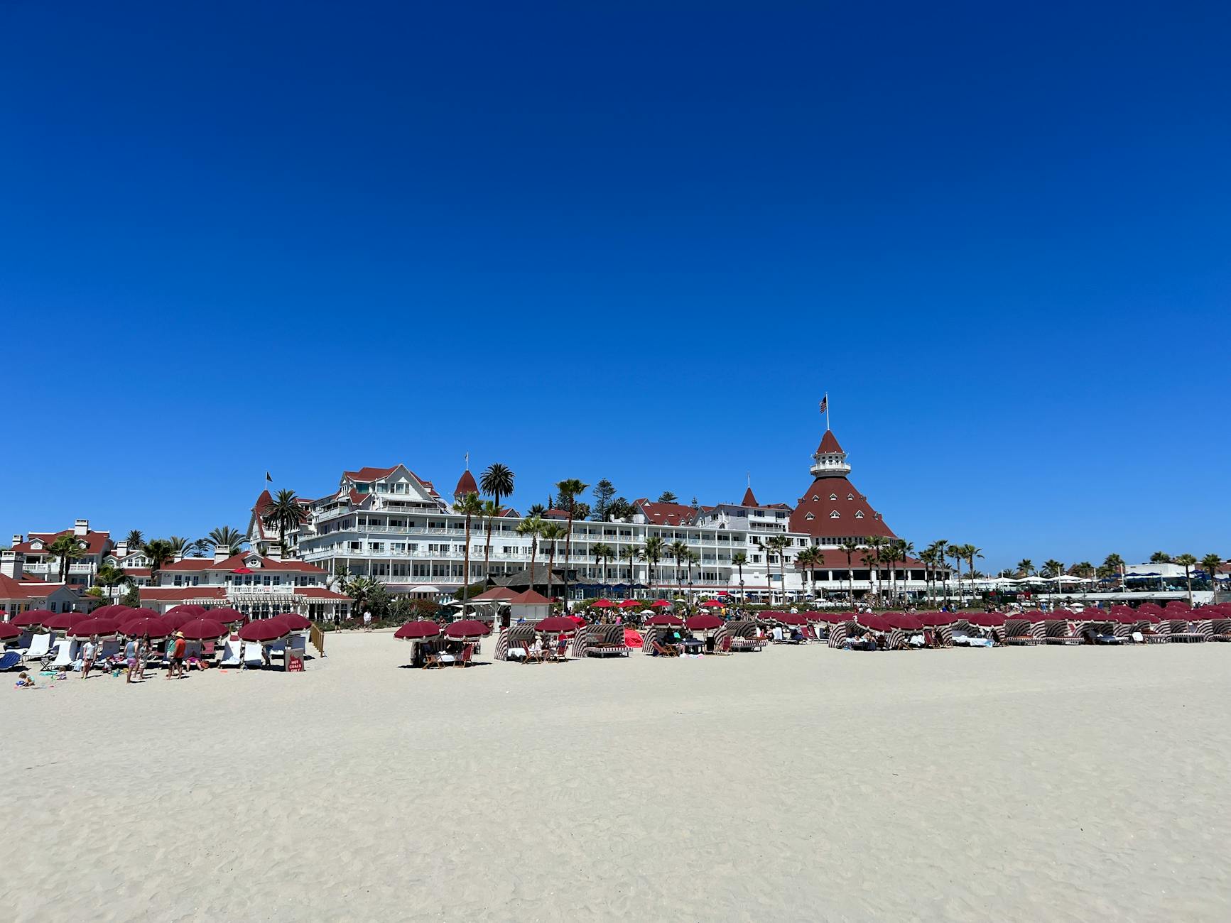 beach umbrellas and lounge chairs on the sandy shore